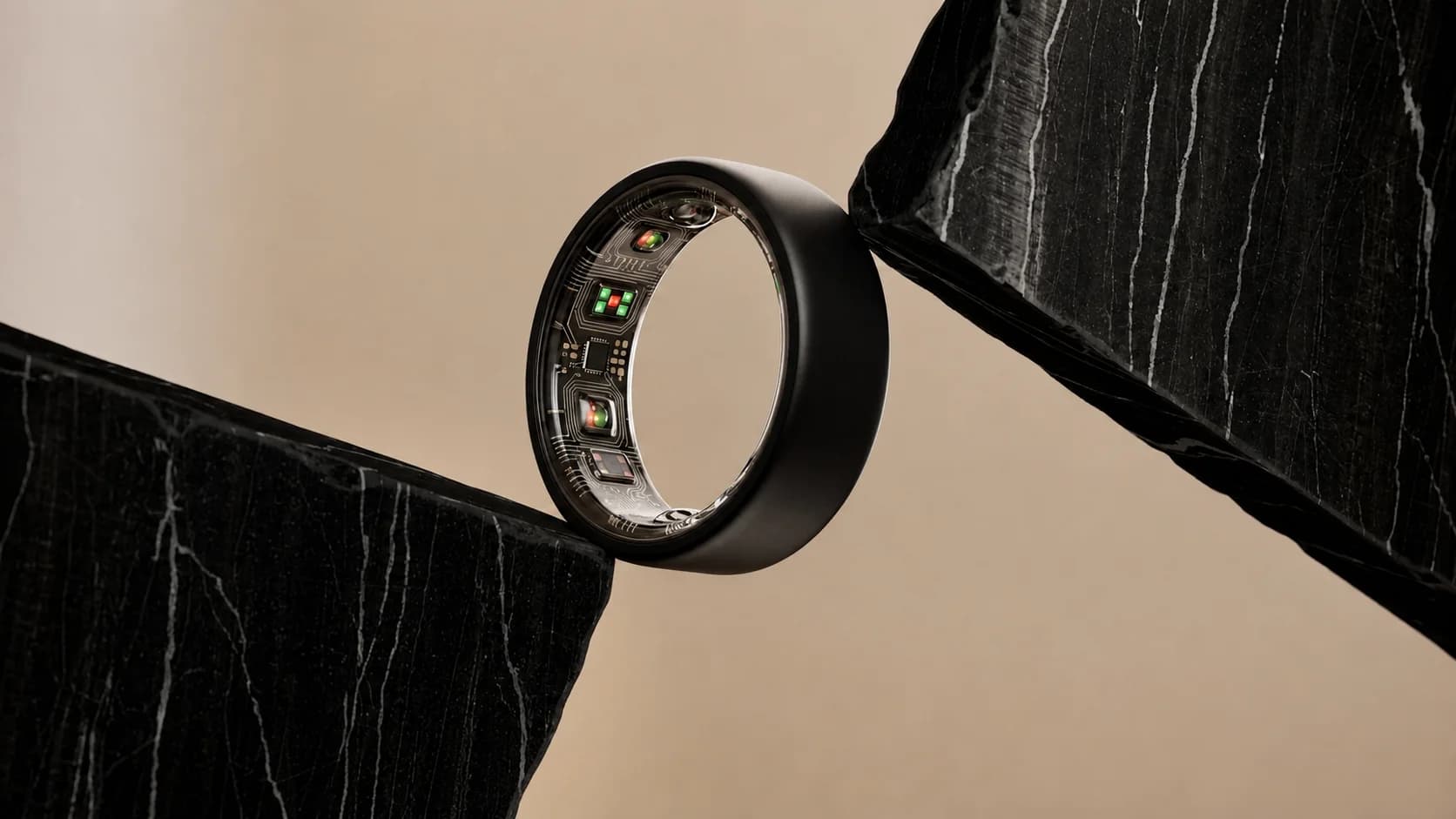 Polished black titanium ring on stone